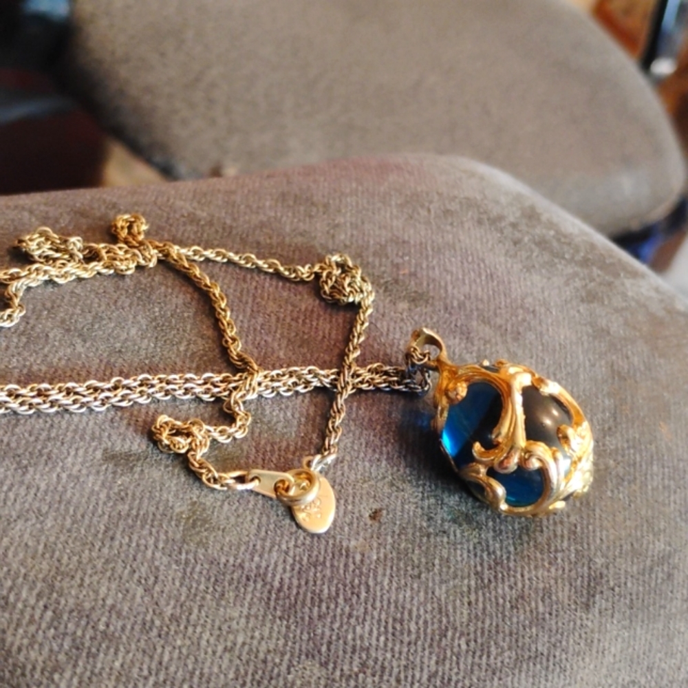 Joan Rivers beautiful gold necklace with blue egg